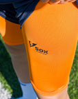 ORANGE LEG WARMERS